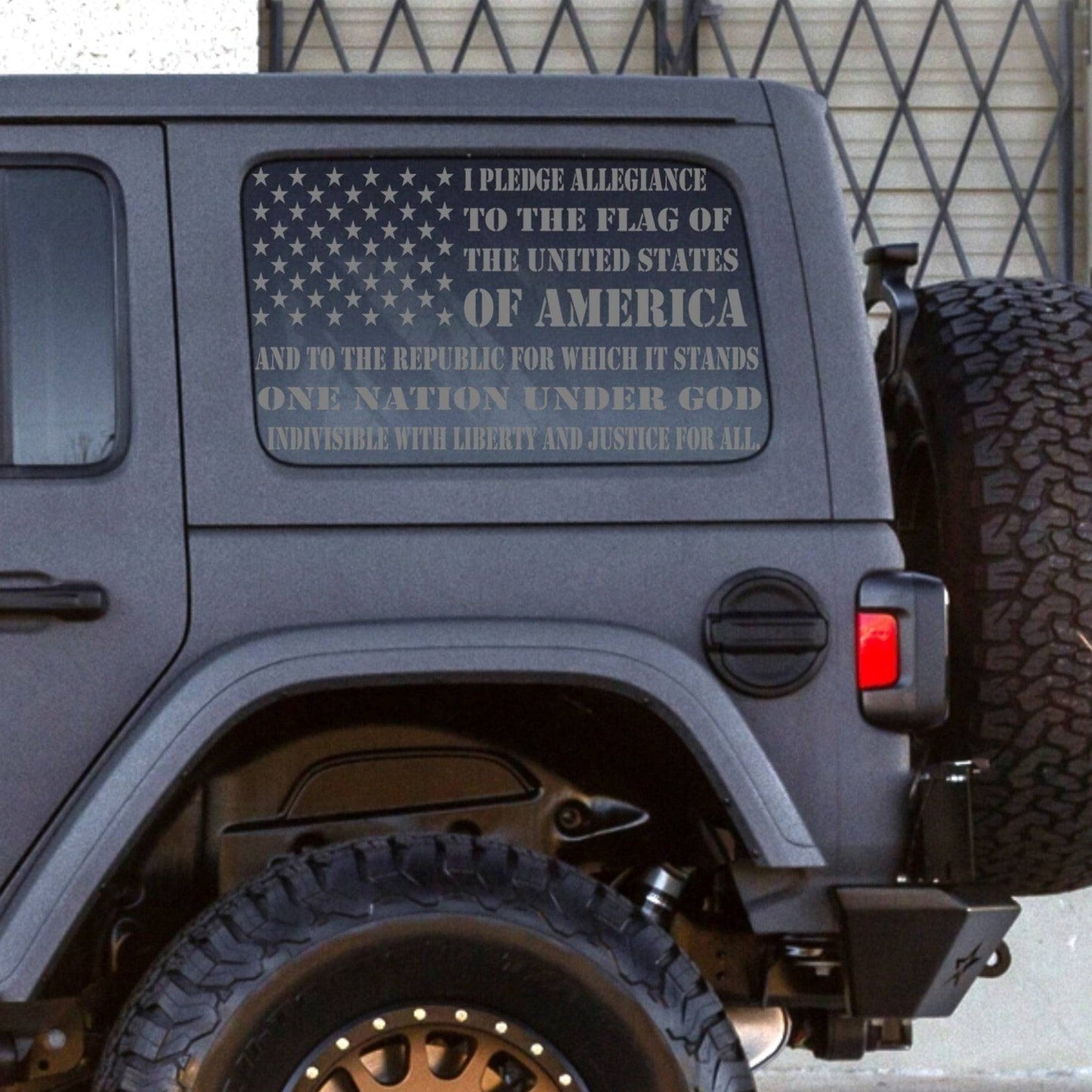 a jeep with an american flag on the back of it